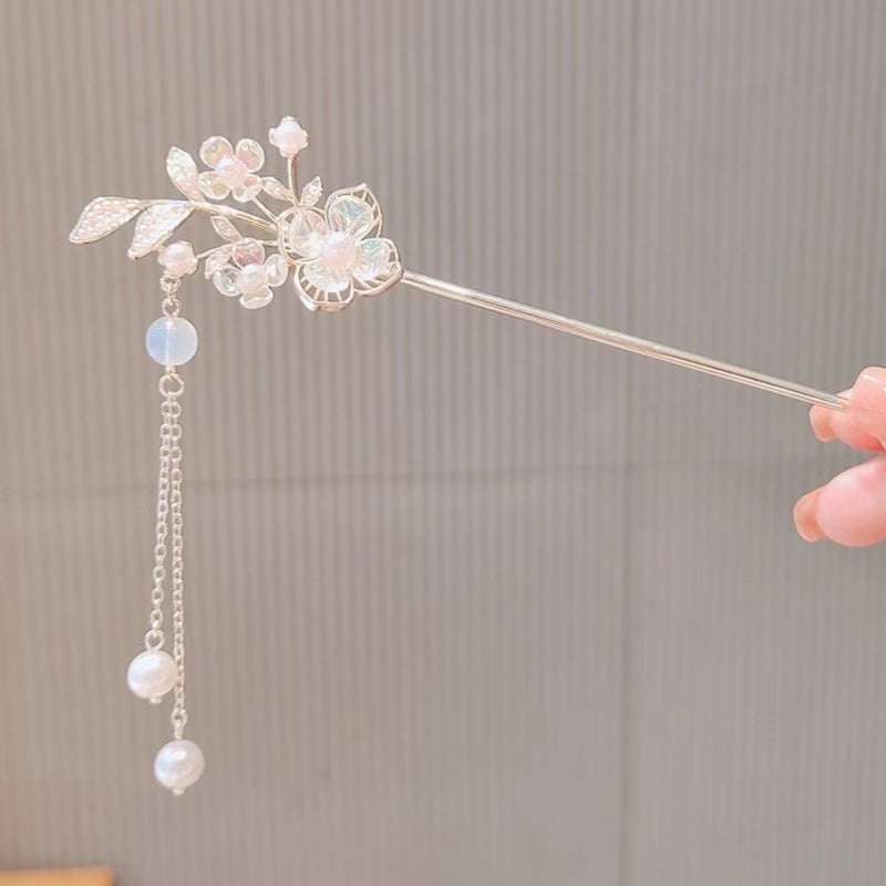 Maiglöckchen-Blumen-Stufenhaarnadel mit High-End-Sinn