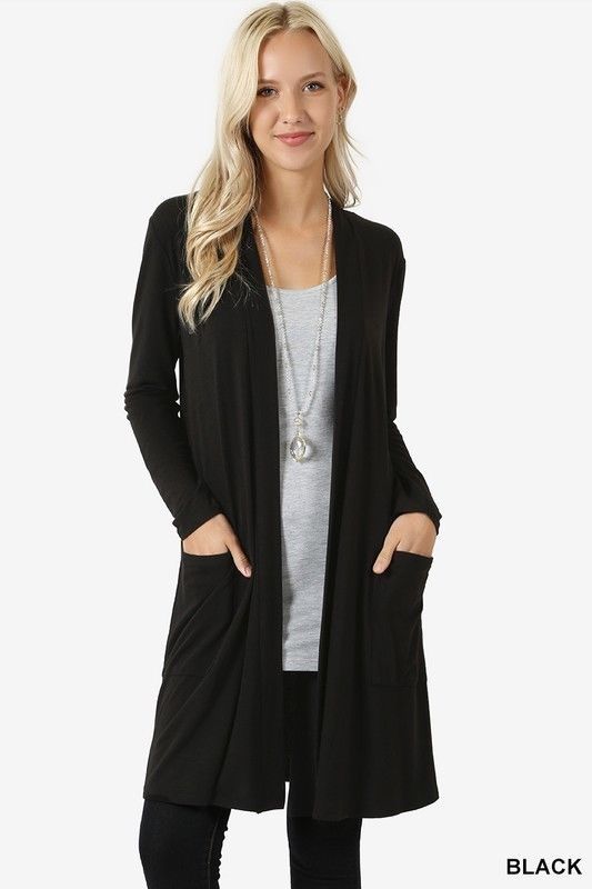 Woman wearing a black cardigan on a white background